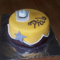 Cowboy Birthday Cowboy cake for a friend of mine's bday. Strawberry cake with bc covered in fondant and fondant accents.