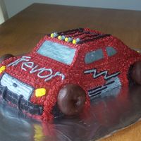 Monster Truck B-Day Cake For a little boy turning 6 who loves cars and trucks. Chocolate cake with bc icing and doughnut wheels.