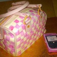 Pink Lv Speedy Purse Louis Vuitton cake and blackberry,pink and white cake, filled with freshed strawberries