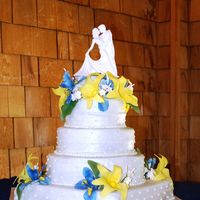 Iris/lily 4-Tier Cake I made this cake for my brother's wedding. The flowers are fondant/gumpaste using the Scott Clark Woolley cutters.