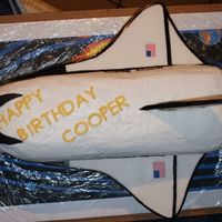 Blast Off!! This was a space shuttle cake I made for a 3 yr old. The wings, tail and boosters are fondant and the cake is buttercream.
