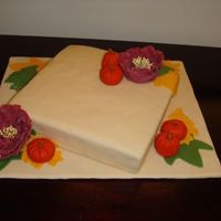Fall 2008 Cake Spice cake with cream cheese frosting. Covered in fondant, with fondant leaves & pumpkins, and gumpaste flowers.