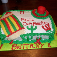 Mexican Theme Yellow cake with buttercreme and fondant accents. Hat is made with rkt and covered in fondant