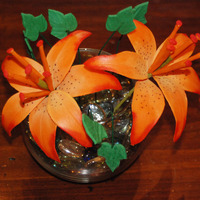 Mother's Day 2010 Two gumpaste tiger lilies with mini gumpaste ivy leaves in a glass bowl.