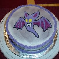 Bat Cake I made this cake for a Halloween party I was going to. Used spray for the black background and traced a pattern onto the cake.