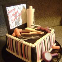 Stylist Work Station cake covered in bc and fondant, scissors and spritz bottle made of fondant, other objects made of chocolate. Mirror made with foam paper...