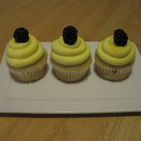Lemon Cupcake Lemon cupcake with lemon buttercream and fresh blackberry on top
