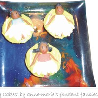 Fairy Cakes In the UK we call cupcakes 'fairy cakes'...so here's my take on fairy cakes...actual fairies on cakes!! They were a real hit...