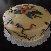 Tapered Cake W/ Flowers And Vines Amaretto Cake with mocha filling. Made this tapered cake for my sister's family celebration for her 22nd birthday.