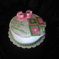 Baby Cake For New Grandmother My mom asked me to make a cake for a party given for a new grandmother. I had some more in mind but it turned into a rush job. I'm not...