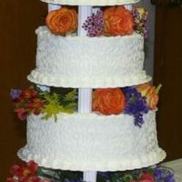 Cornelli Lace Wedding Cake I made this multi tiered wedding cake for my niece. Her colors were orange, purple, and lime so I told her I'd do it in white and she...