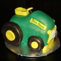 John Deere fondant icing, with chocolate donuts as wheels