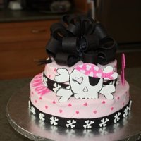 Pink Skull Cake 10 and 6 inch cakes covered in BC with fondant accents. The Bow is made of fondant aswell. Idea from other CC members...thanks!