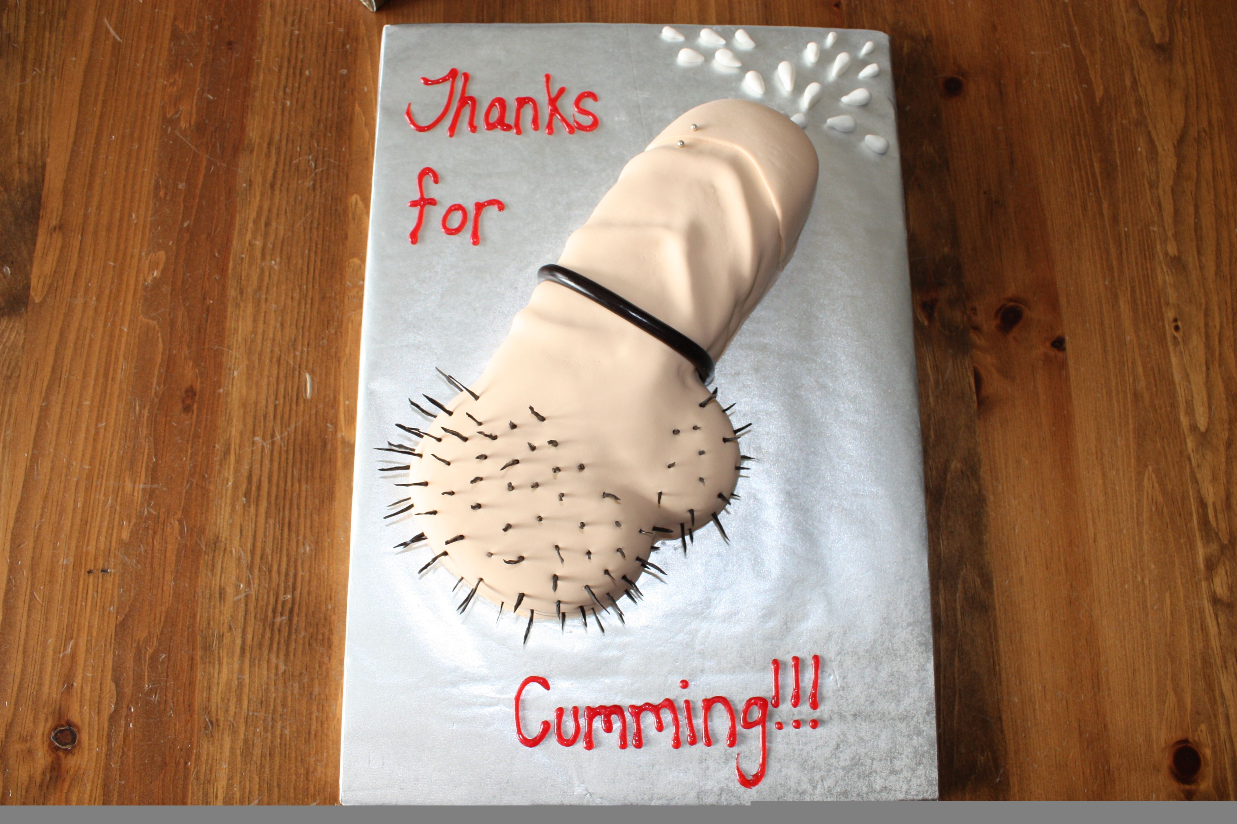 Penis Cake Cake I made for a passion party. 13' x 9' carved cake iced with b/c and covered in fondant. Licorice and fondant accents.