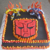 Transformers Cake Cake made with buttercream and fondant except for the 2 transformers on the top of cake (toys). Thank you to all the CC members for the...