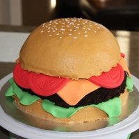 Hamburger 10" chocolate cake covered in BC with fondant accents. The hamburger patty is covered in chocolate BC and then oreo cookie crumbs. TFL...