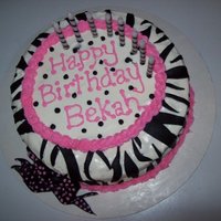 Zebra Stripes Birthday Cake French Vanilla cake with Buttercream icing, and fondant zebra stripes and bow.