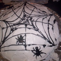 Spider Web Cake Red velvet cake with cream cheese icing, and piped spiderweb with spiders.