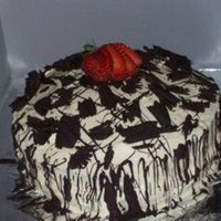 Picture_637.jpg French vanilla cake with Strawberry filling, butter cream icing, and semisweet chocolate curls/drizzle. This cake tasted fantastic.