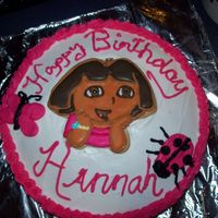 Hannah's 4Th Birthday Dora Cake Vanilla cake with vanilla butter cream icing. Was a fast decorating job since I had to do 2 cakes (one for Hannah and one for her twin...