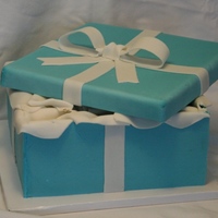 Tiffany Box My first gift box cake! Thanks to bobwonderbuns for inspiration and instruction on how to achieve the proper shade of Tiffany blue, and...
