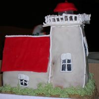 Lighthouse Cake Completely edilble lighthouse cake! Base is 8in square chocolate cake topped with brown sugar sand. Lighthouse is carved out of multiple...