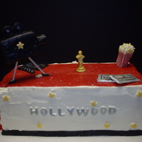 Hollywood Birthday Cake cake covered in buttercream with fondant red carpet. The movie camera was a rice crispy treat covered in fondant.