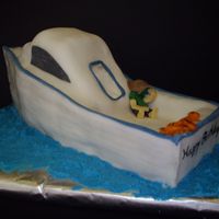 Chesapeake Bay Fishing Boat This is a white cake covered in fondant. I created the lines that looked like wood slats by cutting lines then dusting with luster powder....