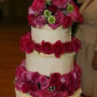 Embossed Chocolate Wedding Cake This cake was for my dad. It is hard to see in the picture but each layer is wrapped in embossed white chocolate. I used 13 dozen roses.