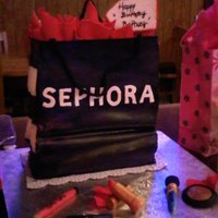 Shopping Bag Cake This is a cake that I made for my daughters birthday. The cake was layers of red velvet and double dark chocolate with white chocolate...