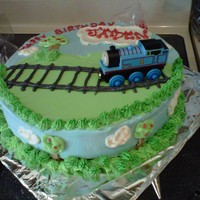 Thomas The Tank Engine This cake was done for a friend's little guy who is really into Thomas right now. The cake is french vanilla with vanilla buttercream...
