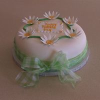 Daisy Cake Vanilla rum cake, bc w/ fondant, gumpaste daisy and real ribbon. My take on a cake found online that I saved a pic of.