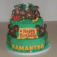 Party Monkeys 2 tiers iced in buttercream. Monkeys are chocolate transfers.