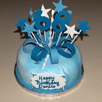 Fondant Cake With Gumpaste Star And Loop Topper I did this cake a few months back. It's a vanilla rum cake inced in bc and covered in marbled fondant. The topper is made of fondant...