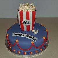 Popcorn Birthday Cake This was for my daughter's 6th birthday party. Her theme was popcorn. The box is fondant covered styrofoam, real popcorn, everything...