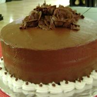Chocolate_Roses_Cake.jpg chocolate cake with caramel fudge filling. Chocoalte buttercream- wilton recipe.made in class.