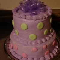 Polka Dots :) My first tiered cake. Layers are 9 and 6". Covered in buttercream with royal icing polka dots.