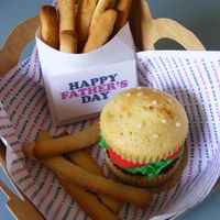 Father's Day Burger And Fries! Inspired by Bakerella! Sugar cookie fries, white cake bun with buttercream lettuce, fondant tomato's and marzipan sesame seeds.