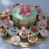 Farm Theme Birthday Cake Orange Butter 6"x4" center piece with Jaffa Chocolate Cuppies. Fondant piggies and puppies.