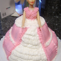 Barbie Cake White and chocolate cake covered in buttercream. First barbie cake. I think it came out ok but, I learned a few things I will do different...