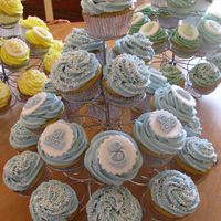 Img_0459_1.jpg Baby shower cupcakes. Vanilla cake, vanilla buttercream swirls, fondant decorations. Thanks for looking.