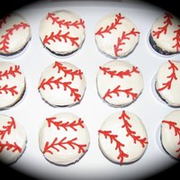Baseball Cupcakes Also for my best friend's little boy's 1st birthday...to go with the baseball cap cake. These were so much harder than I thought...