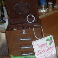 Jewelry Box Birthday Cake Carrot cake with cream cheese filling. Covered in colored fondant. Top of jewelry box done in chocolate. Rose is chocolate. Flower and bow...