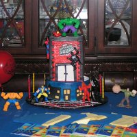 Super Hero Squad My sons 6th birthday cake .Half chcocolate cake with chocolate butter cream ,half coffee cake with chocolate filling .Covered with fondant...