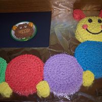 Baby Einstein This was my now 4 yr. olds 1st birthday cake. Before I took any classes. Every circle was a different flavor and all in buttercream. TFL