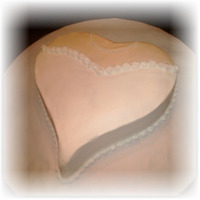 Bridal Shower Carrot cake with lemon cream cheese filling, buttercream icing and pearl non-perials for the pearl necklace.