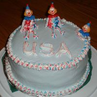 Wilton Class I - Clown Cake Clown Cake from Week 3 of Wilton Class. Sorry about the green shelf paper - it was only there to keep my cake from slipping in the carrier...