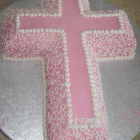 Pink Cross covered with buttercream, with a very quick lace job