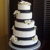 Wedding Cake Cala lilies and fabric ribbon on buttercream icing