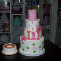 Emma's 1St Birthday Cake THe bottom is 10" and 6" tall, the top 6 and 8 are dummies all iced in buttercream and fondant accents. The crown is fondant.